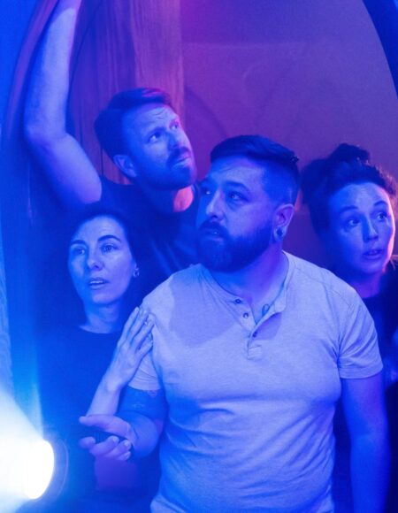 Group walking into a spooky themed escape room at Escapology