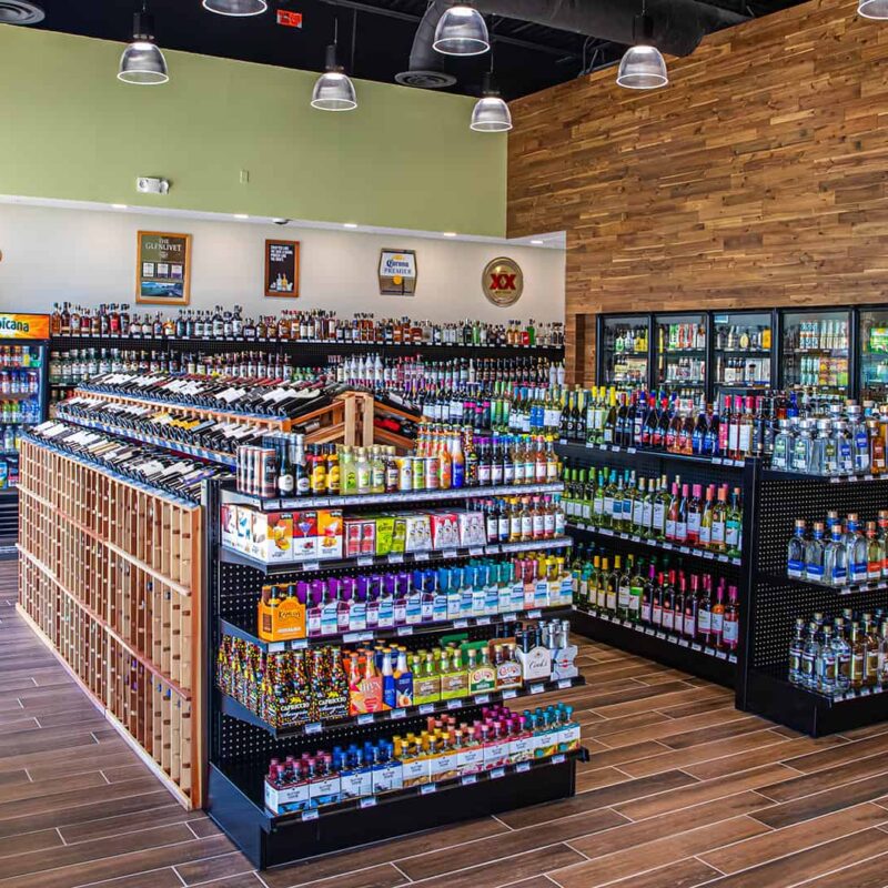 Paradise Spirits’ stocked shelves with bottles at the Promenade at Sunset Walk