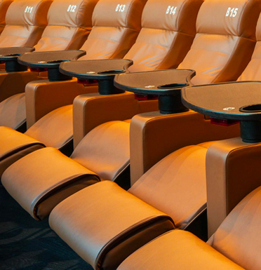 Movie theater seats at Studio Movie Grill at the Promenade at Sunset Walk
