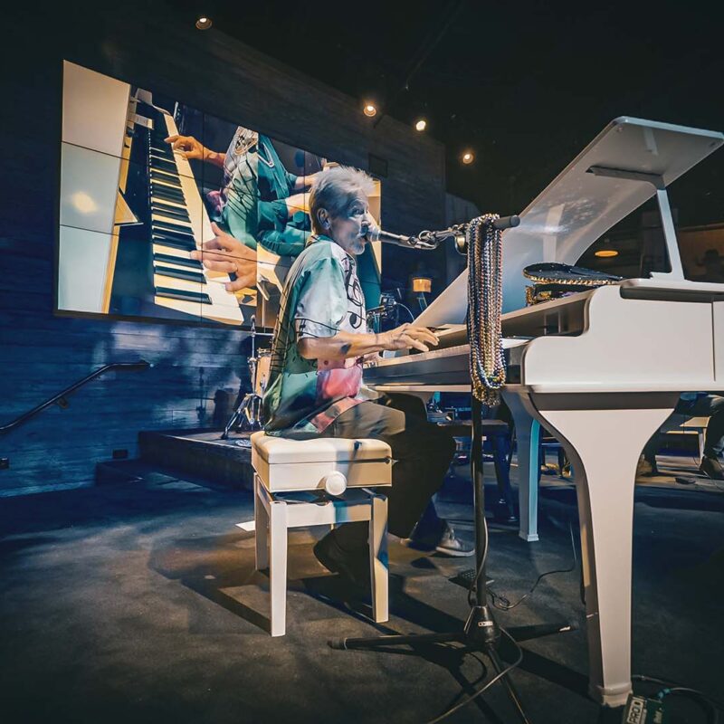 Piano player performing at The Wharf during Dockside Dueling Pianos
