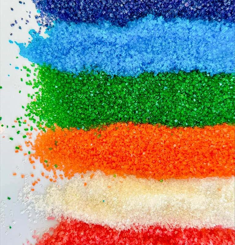 Rows of colorful flavored sugar used to make cotton candy