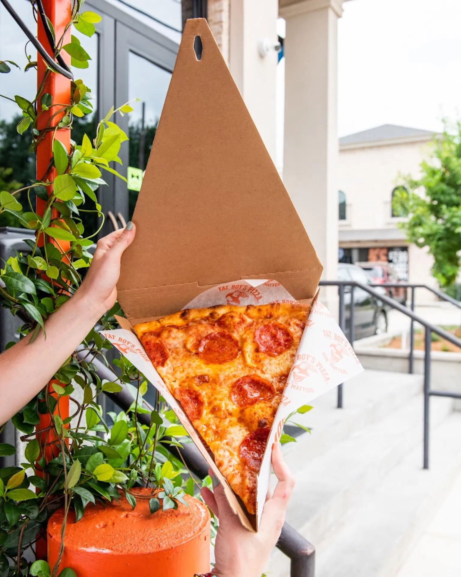 Large slice of pepperoni pizza from Fat Boy’s Pizza
