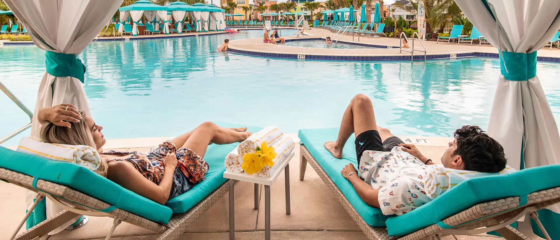 Couple relaxing in a private poolside cabana at Margaritaville Resort Orlando