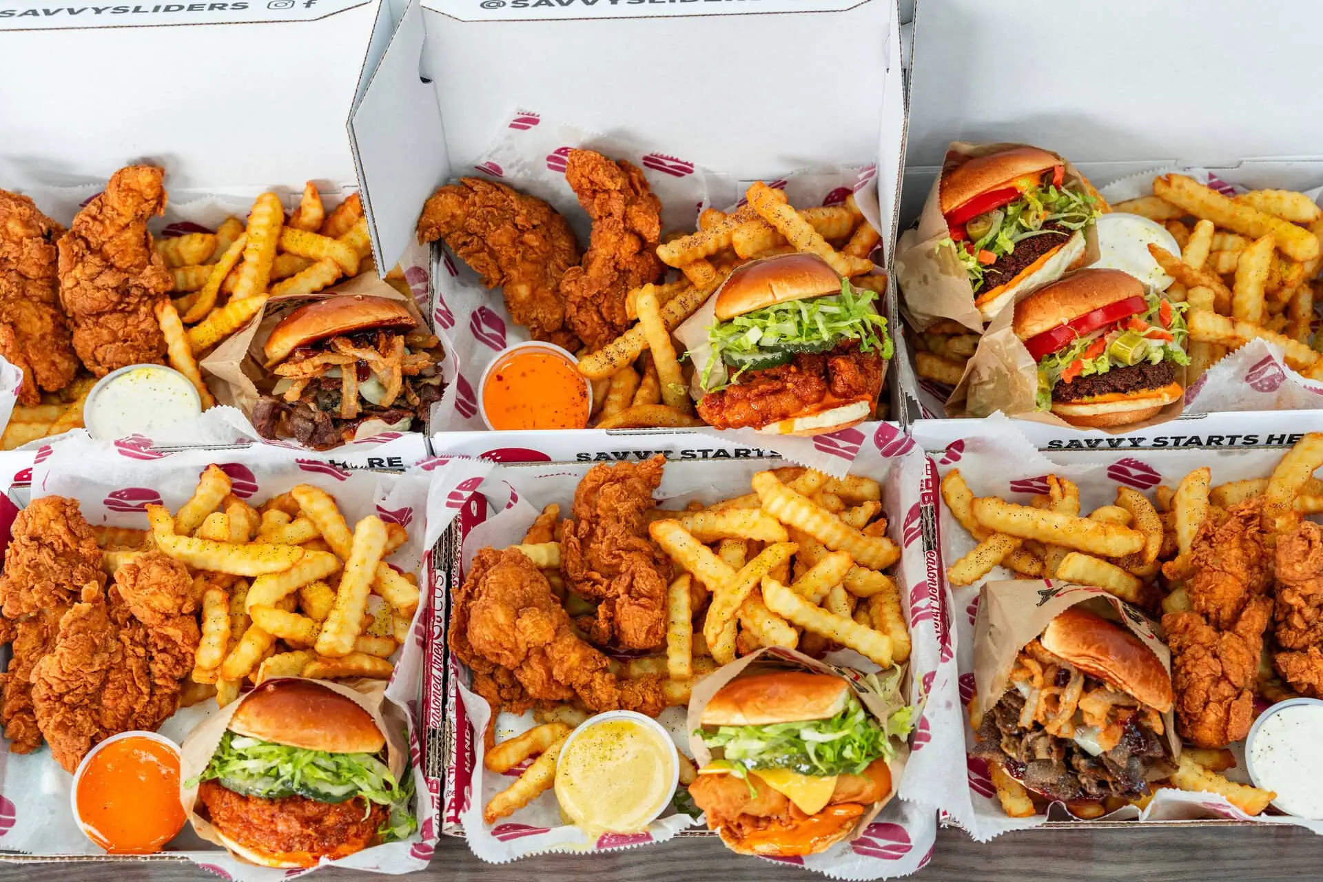 Savvy Sliders combo boxes featuring fried chicken, French fries, and dipping sauces