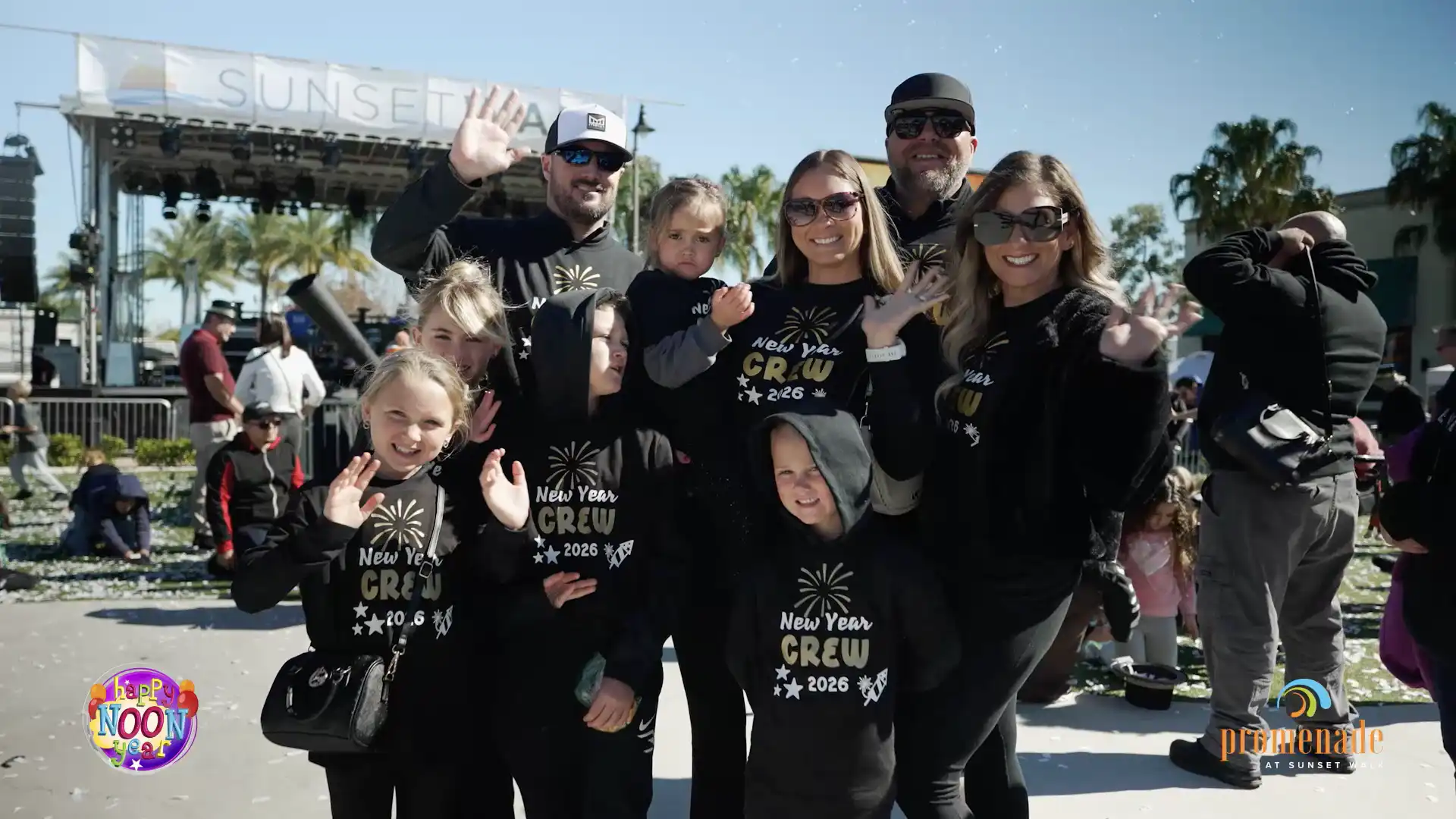 Family in matching New Year’s Crew shirts at the Happy Noon Year 2026 event.