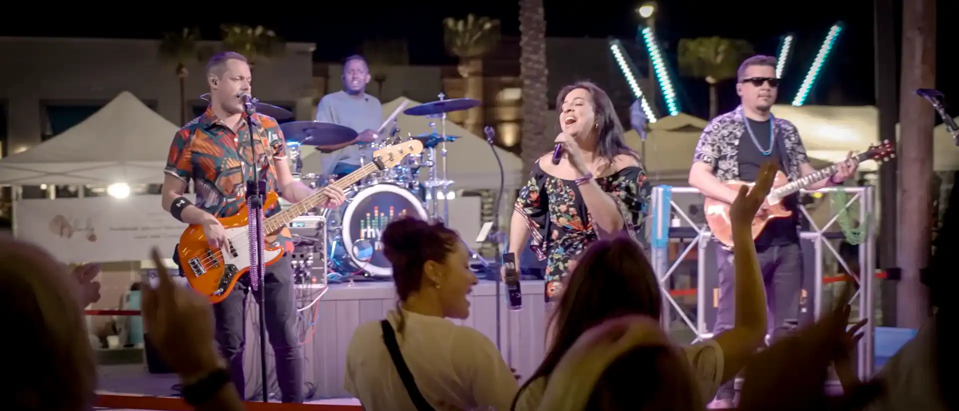 The band Rhythm Me Up performs live on the Promenade Plaza Stage