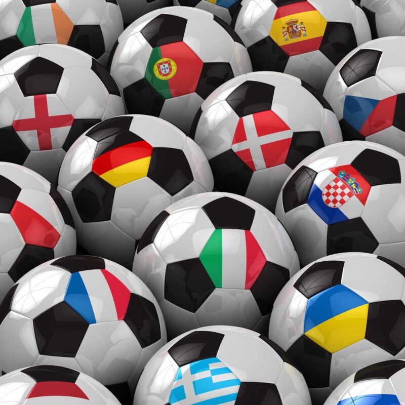 Group of soccer balls with different flags on a hexagon space